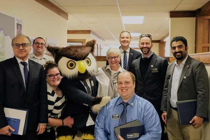 Jacen Bridges with co-workers and hootie